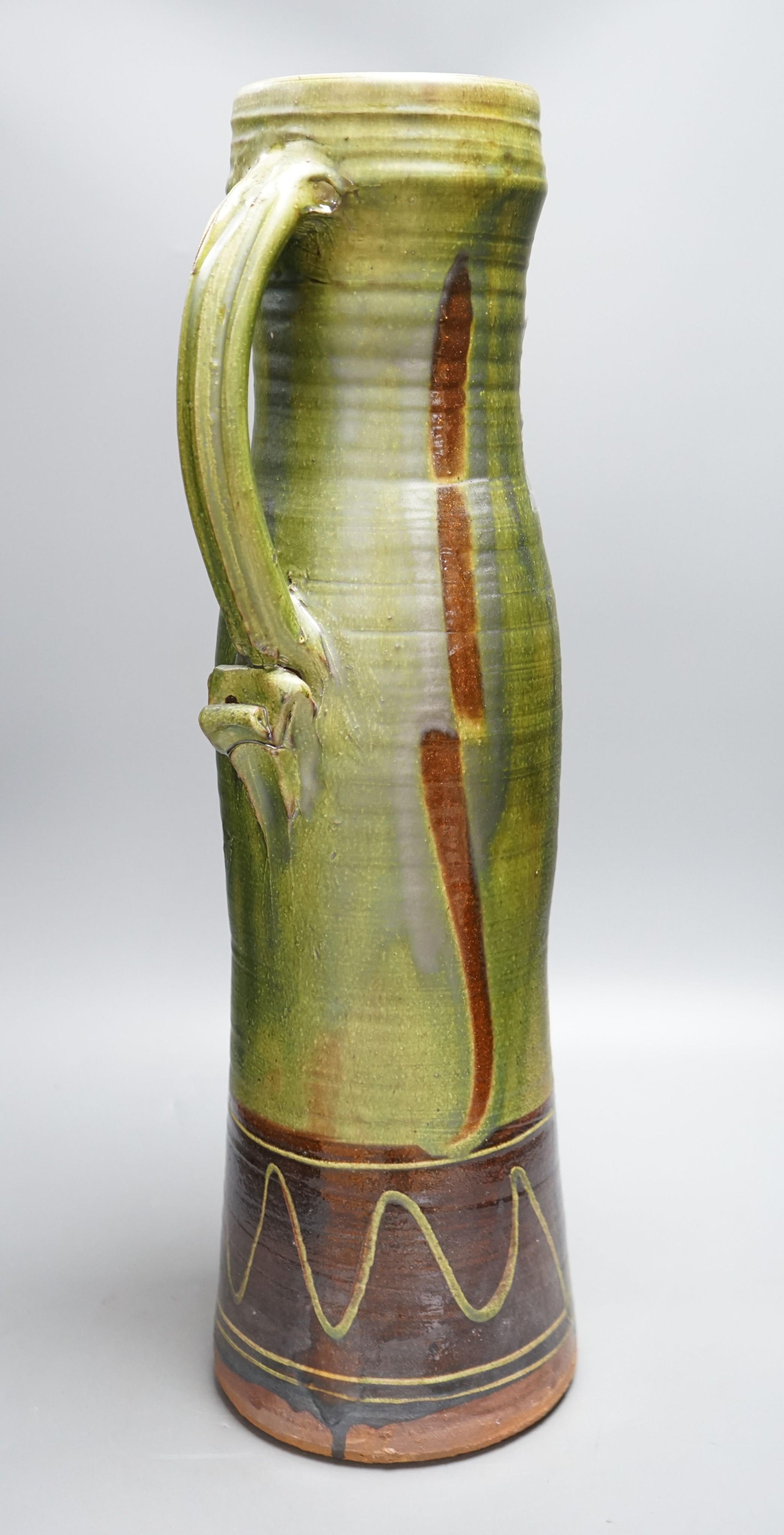 Clive Bowen (b.1943), a tall green glazed and brown slip decorated ewer, 59cm